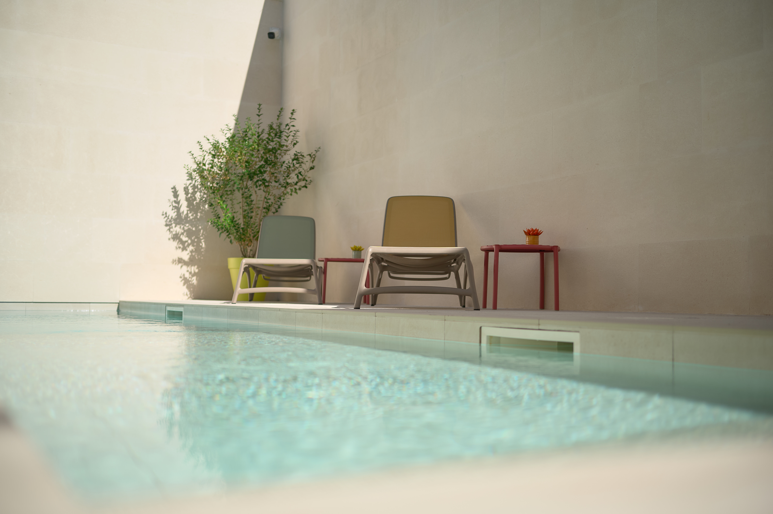 Artistic picture of the pool with outdoor shower in the back